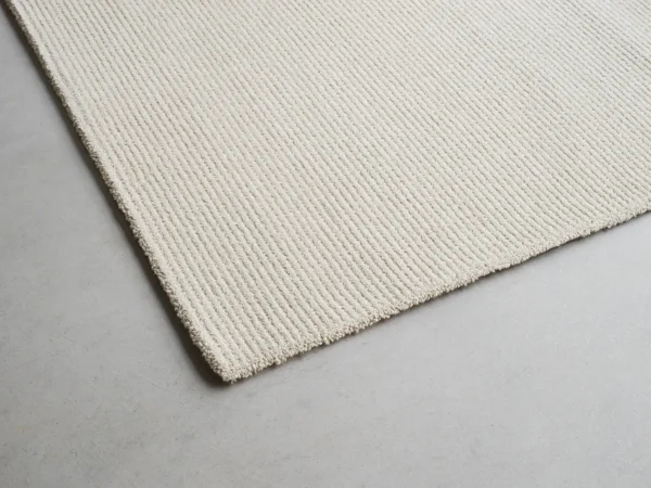 The edge of our rug Sow from our Field collection.