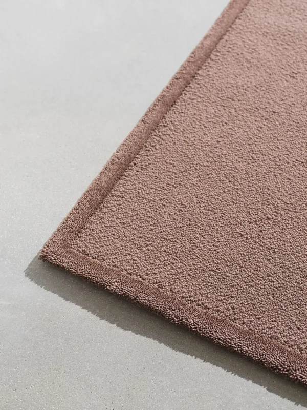 Frame concept rug in deep brown colour