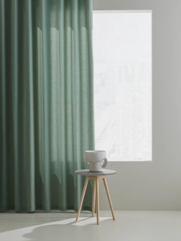 Panorama II gardintyg i ett fönster med designmöbler