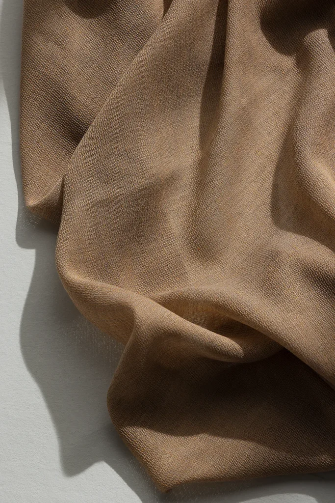 Detail of ZEN transparent hanging textile with a refined woven texture and soft drape.