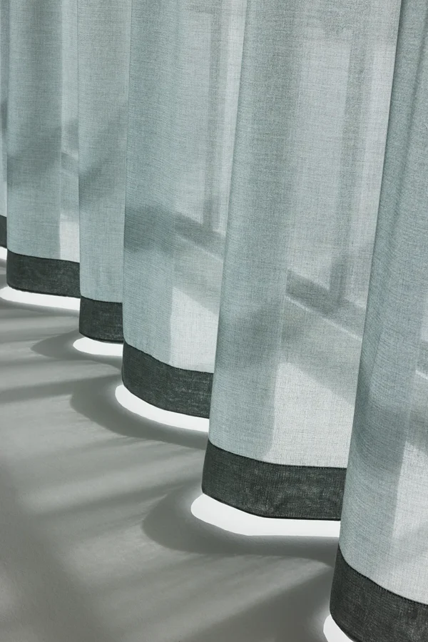 ZEN transparent hanging textile with soft drape and subtle woven texture, filtering daylight.