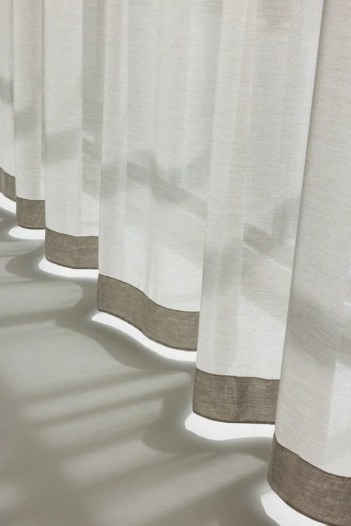 ZEN transparent hanging textile with soft drape and subtle woven texture, filtering daylight.