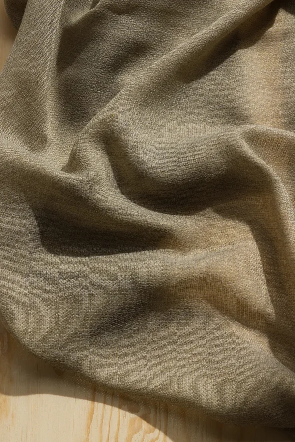 Detail of ZEN transparent hanging textile with a refined woven texture and soft drape.