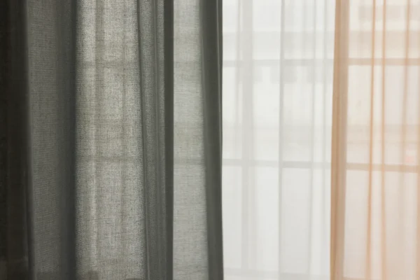 ZEN transparent hanging textile with soft drape and subtle woven texture, filtering daylight.