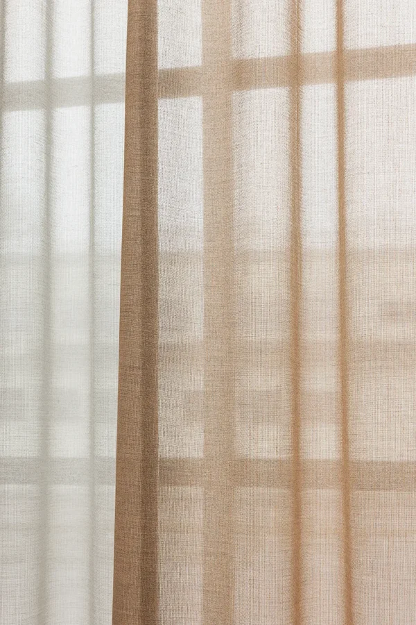 ZEN transparent hanging textile in layered neutral tones, softly filtering daylight.