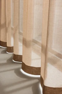 ZEN transparent hanging textile with soft drape and subtle woven texture, filtering daylight.