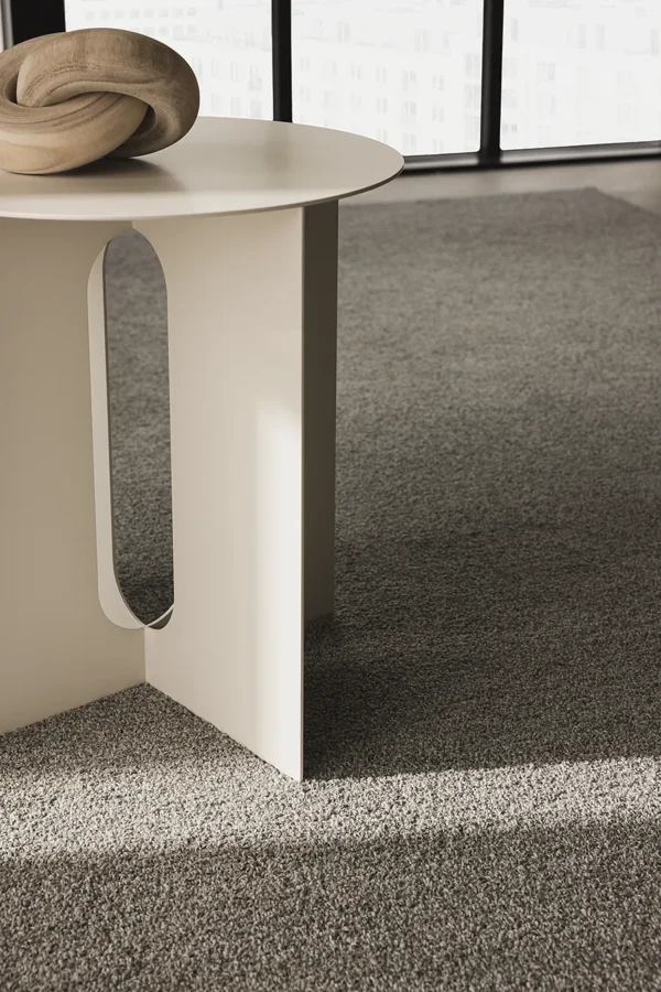 YTA loop rug in a neutral lounge interior.