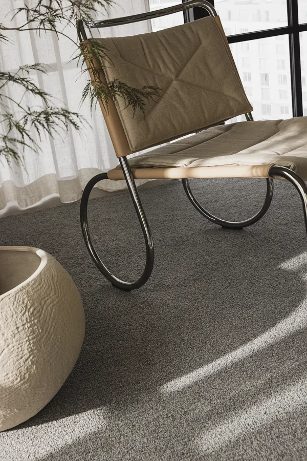YTA loop rug in a neutral lounge interior. Close-up